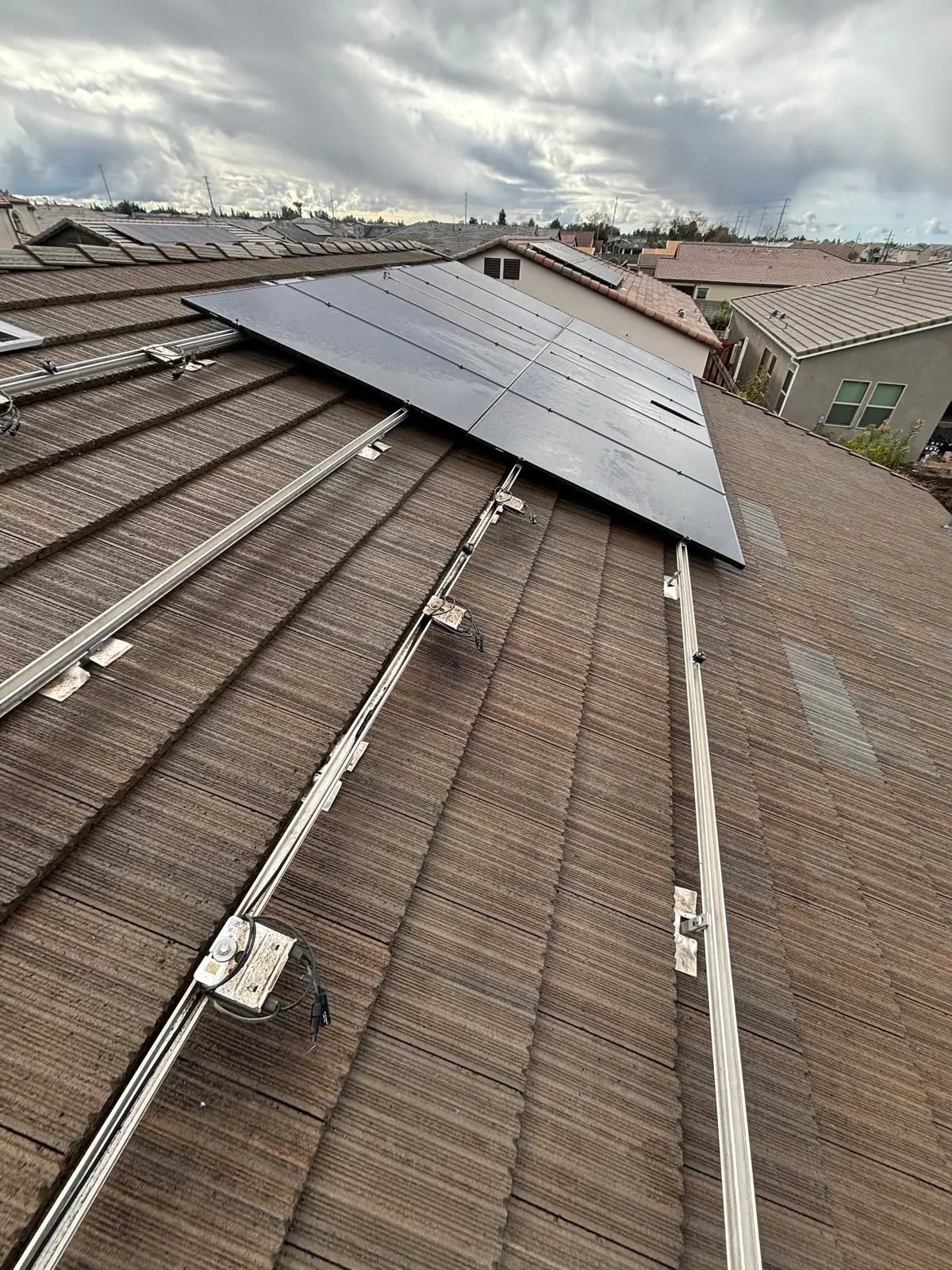 Roof rails and an exposed roof section alongside solar panels